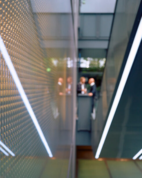 Photo of corridors where two members of the Enki Capital investment team can be seen.